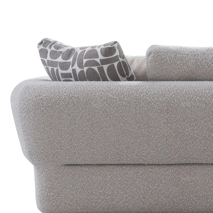 Modern boucle fabric 4 seater sofa couch with context.