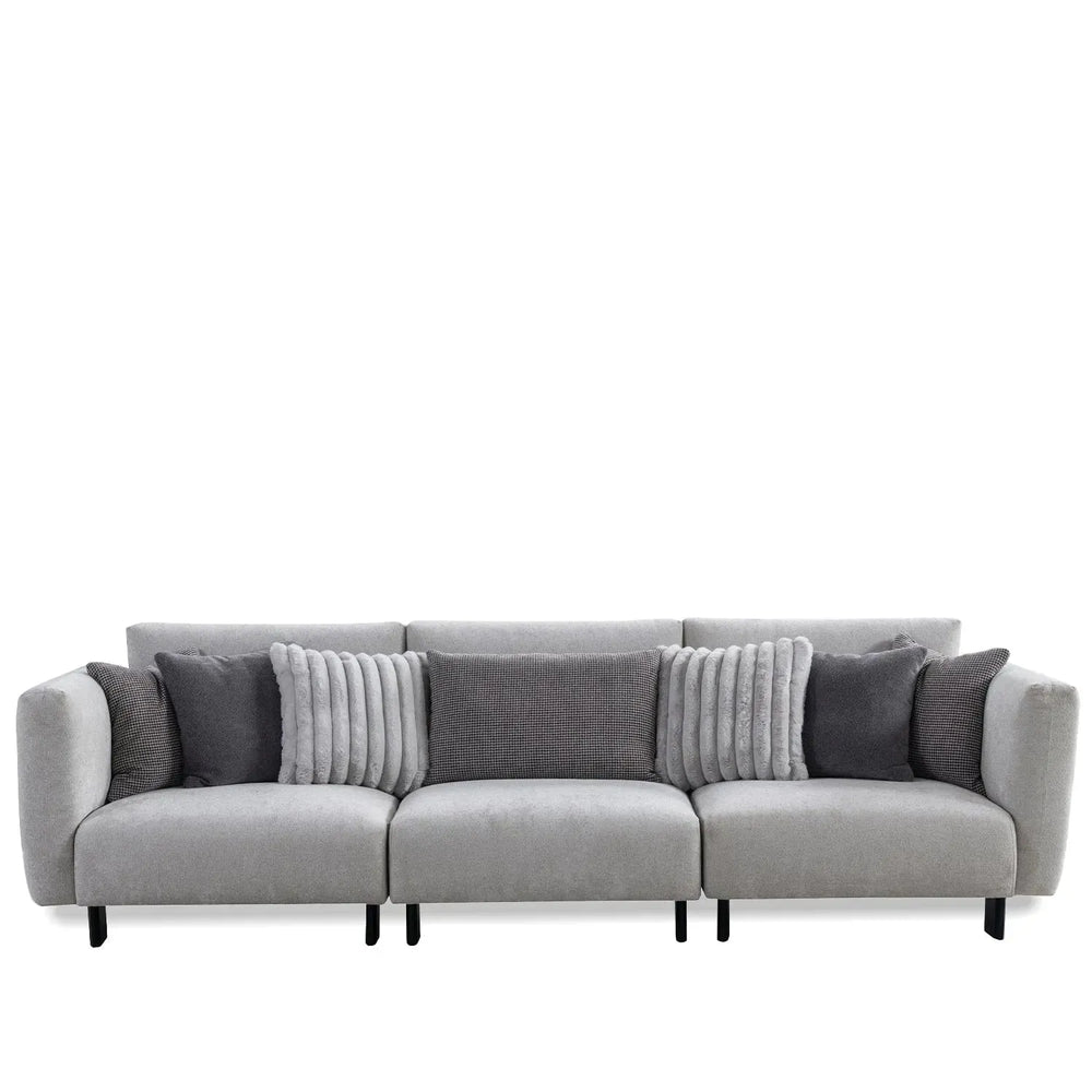 Modern boucle fabric bendable armrest 4 seater sofa pristine in white background.
