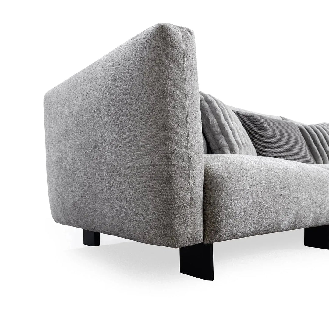 Modern boucle fabric bendable armrest 4 seater sofa pristine in real life style.