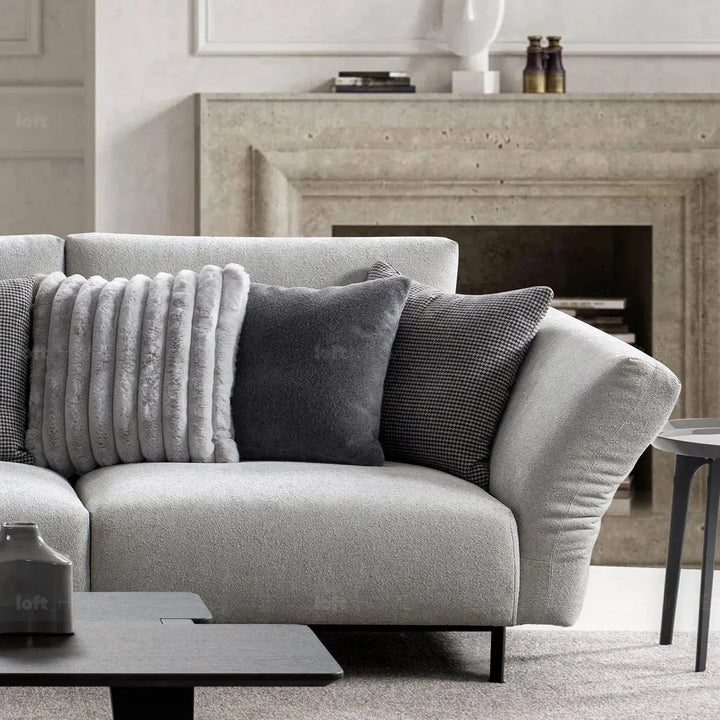 Modern boucle fabric bendable armrest 4 seater sofa pristine in details.