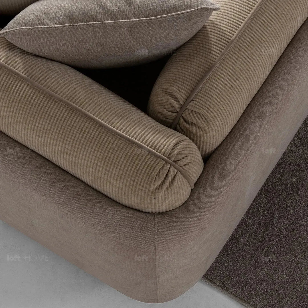 Modern corduroy velvet fabric 4 seater sofa fluff in still life.