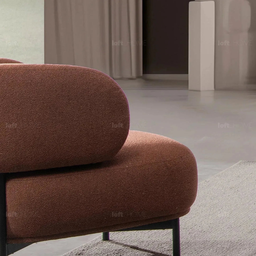 Cream mixed weave fabric 1 seater sofa hinger in still life.