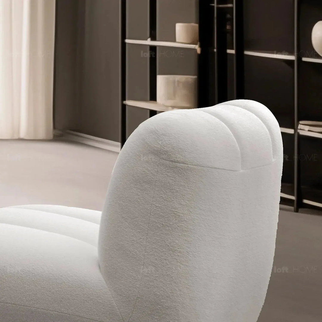 Cream sherpa fabric revolving 1 seater sofa limestone in still life.