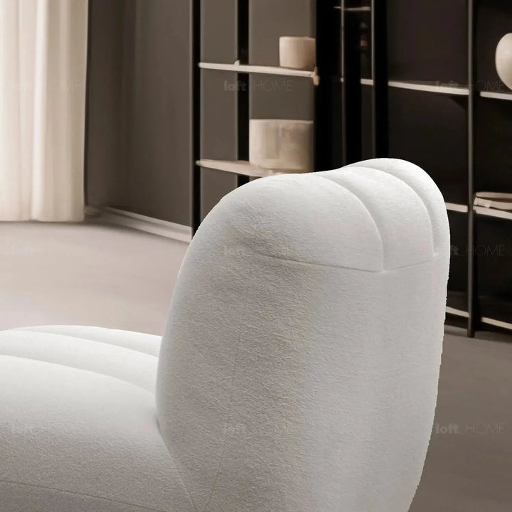 Cream sherpa fabric revolving 1 seater sofa limestone in still life.