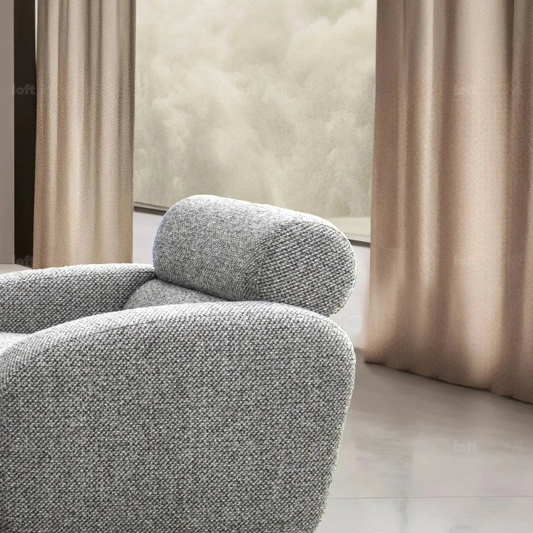 Modern mixed weave fabric 1 seater sofa monolithe in still life.