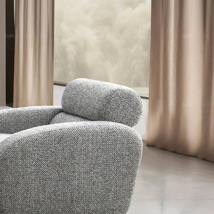 Modern mixed weave fabric 1 seater sofa monolithe in still life.