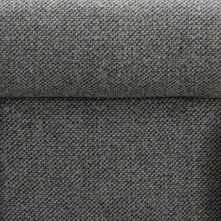 Modern mixed weave fabric 1 seater sofa monolithe in close up details.