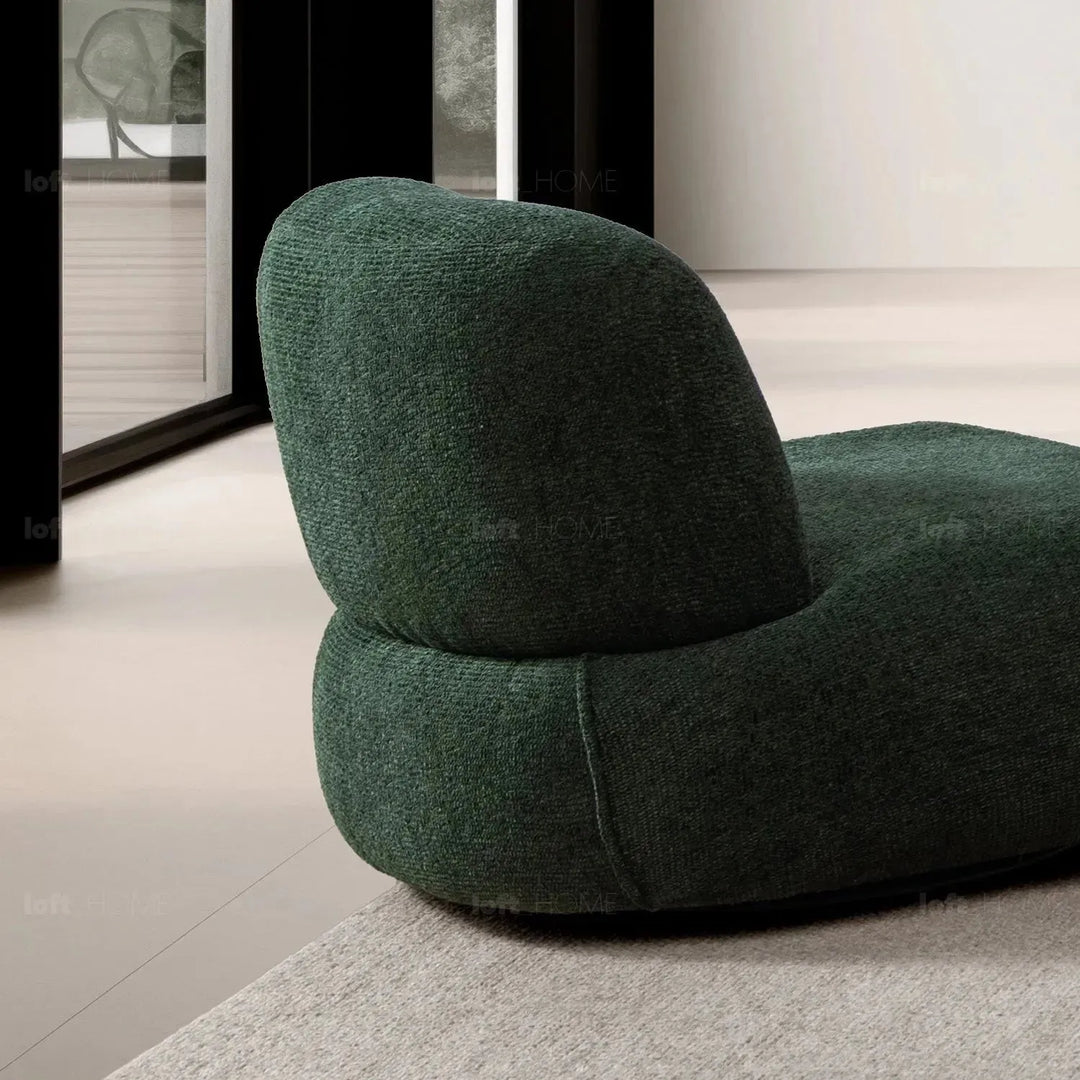 Cream mixed weave fabric revolving 1 seater sofa moss in still life.