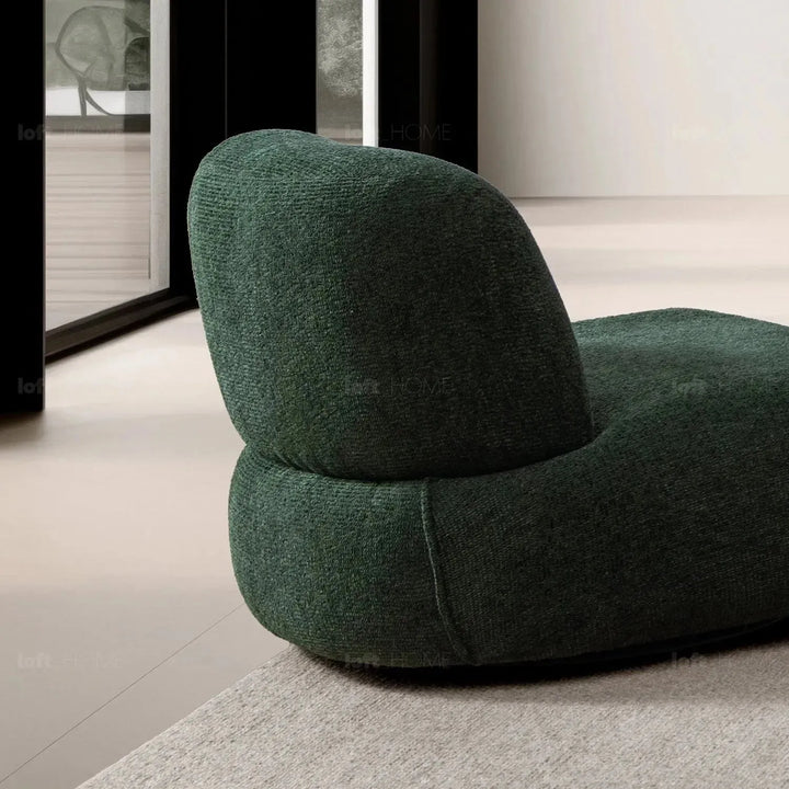 Cream mixed weave fabric revolving 1 seater sofa moss in still life.