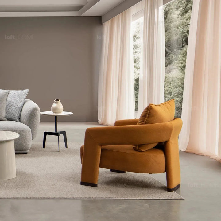 Modern suede fabric 1 seater sofa pheral in still life.