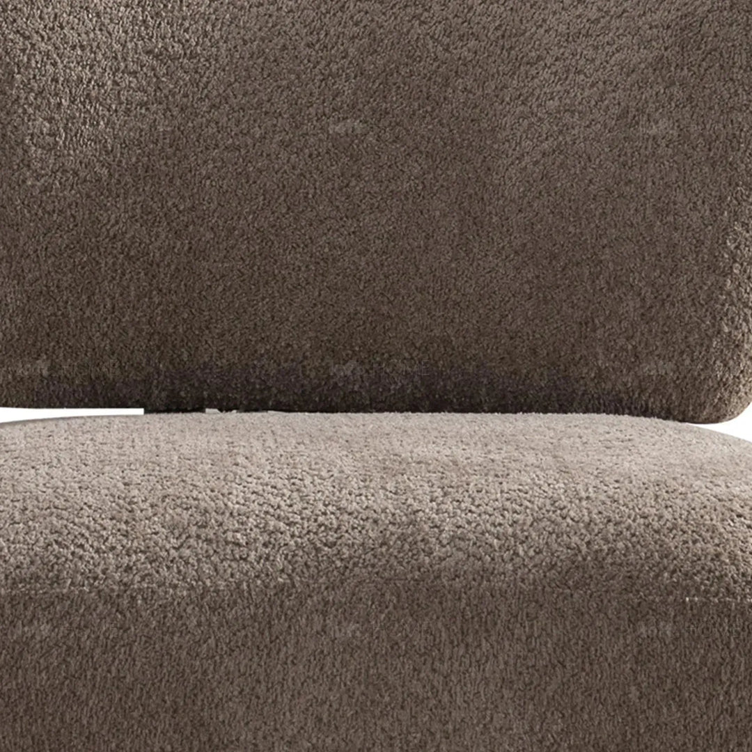 Cream sherpa fabric revolving 1 seater sofa rite in panoramic view.
