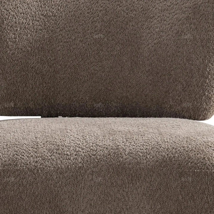 Cream sherpa fabric revolving 1 seater sofa rite in panoramic view.