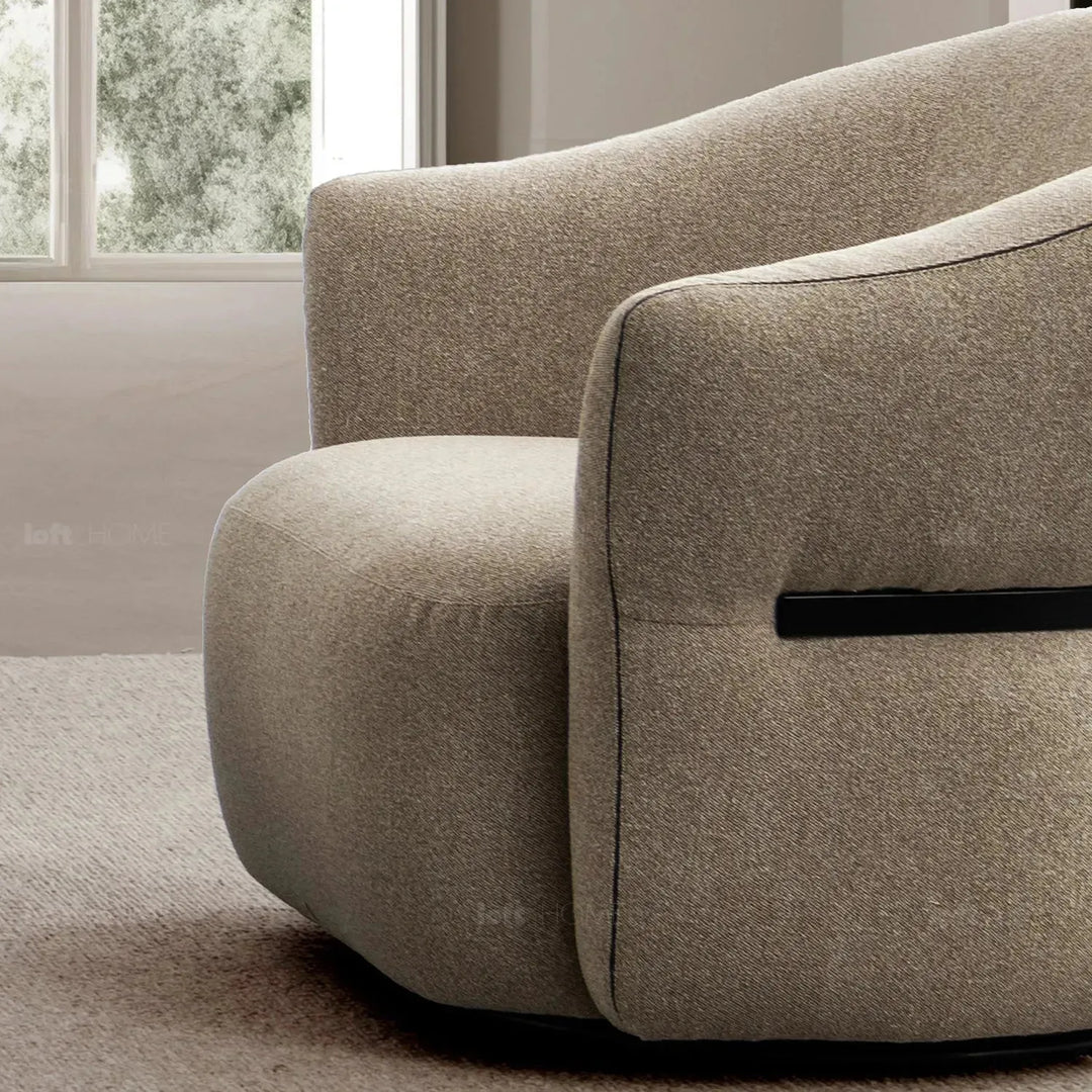 Modern mixed weave fabric revolving 1 seater sofa slate in panoramic view.