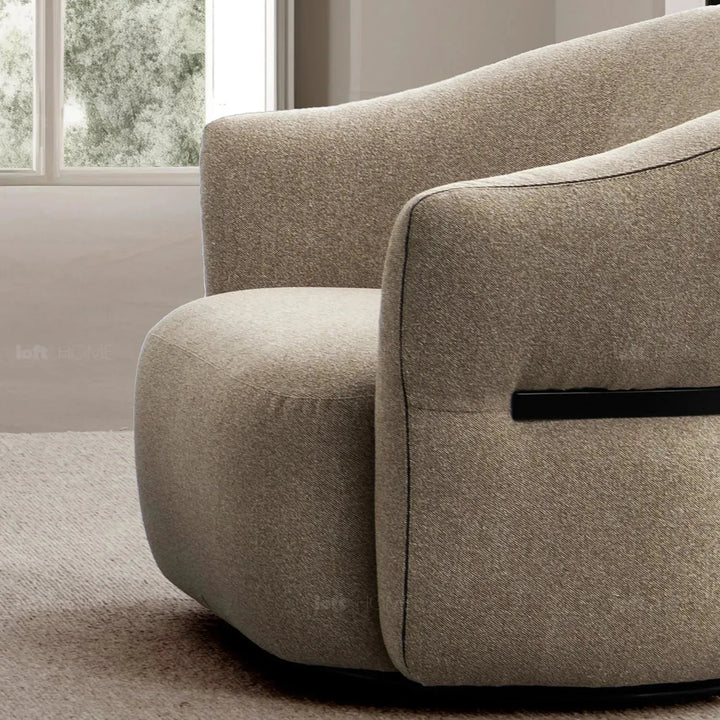 Modern mixed weave fabric revolving 1 seater sofa slate in panoramic view.