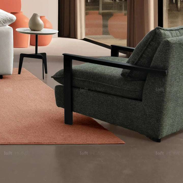 Modern mixed weave fabric 1 seater sofa turret in close up details.