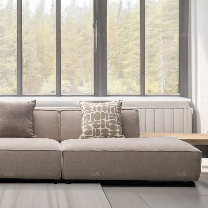 Minimalist mixed weave fabric 5 seater sofa glade in panoramic view.