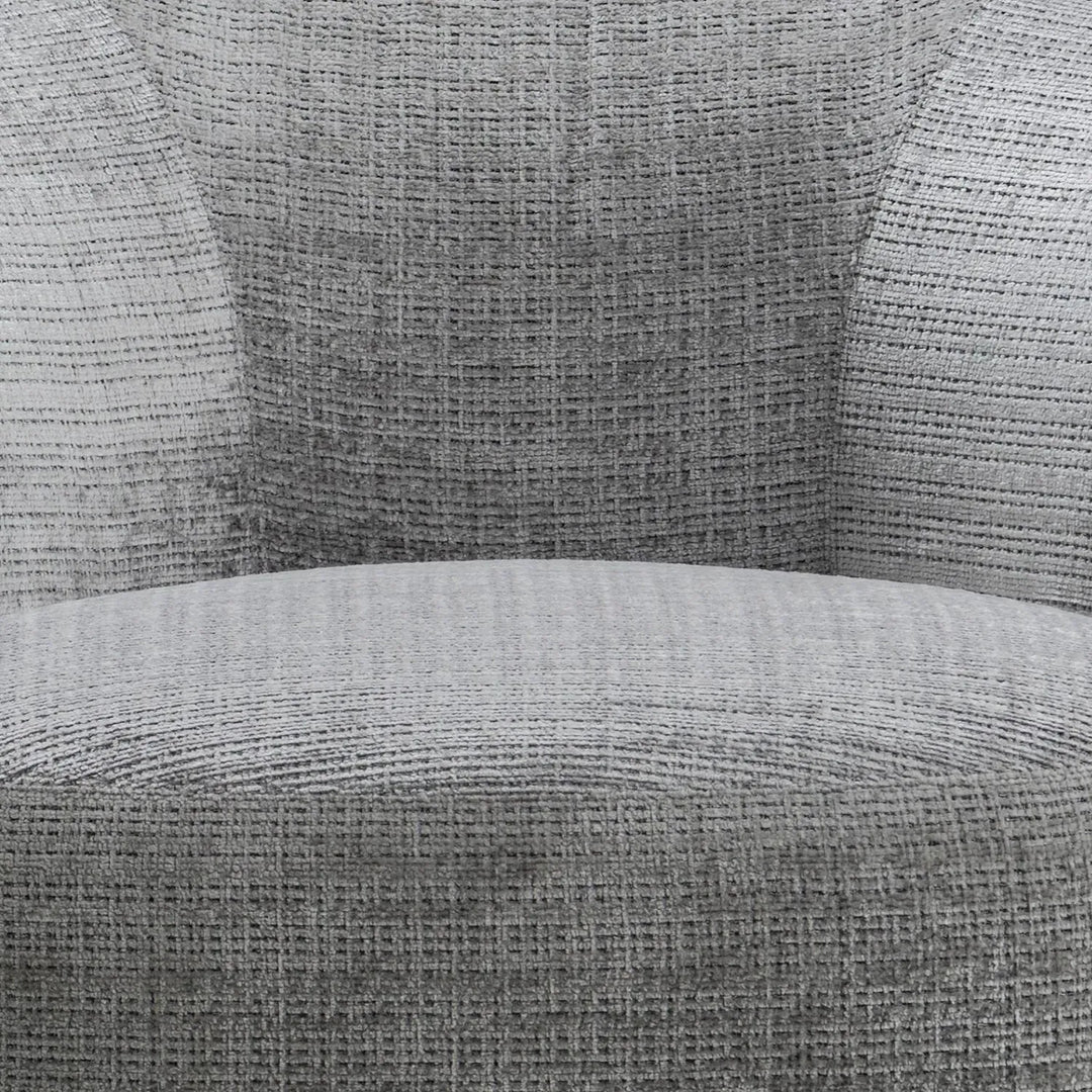 Cream mixed weave fabric revolving 1 seater sofa criet in panoramic view.
