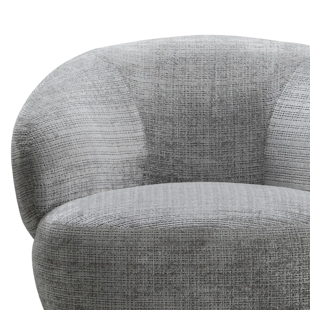 Cream mixed weave fabric revolving 1 seater sofa criet with context.