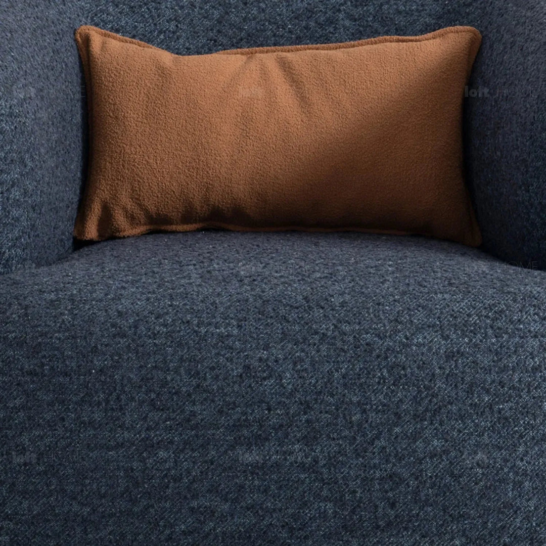 Cream boucle fabric revolving 1 seater sofa vance in close up details.