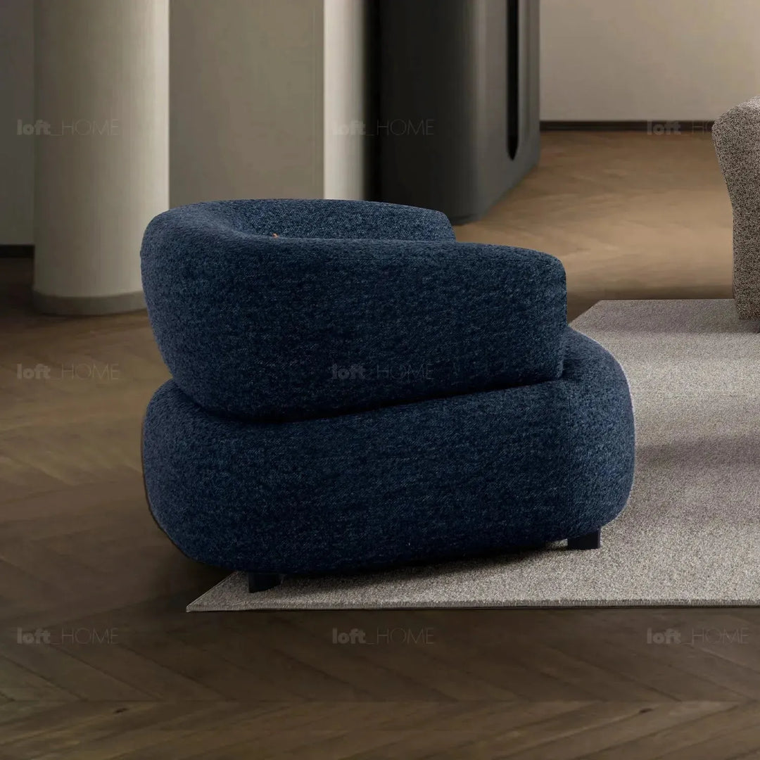 Cream boucle fabric revolving 1 seater sofa vance in details.