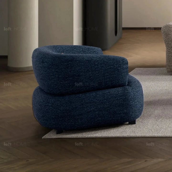 Cream boucle fabric revolving 1 seater sofa vance in details.