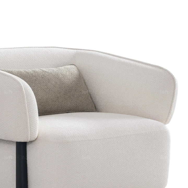 Cream mixed weave fabric 1 seater sofa callee with context.