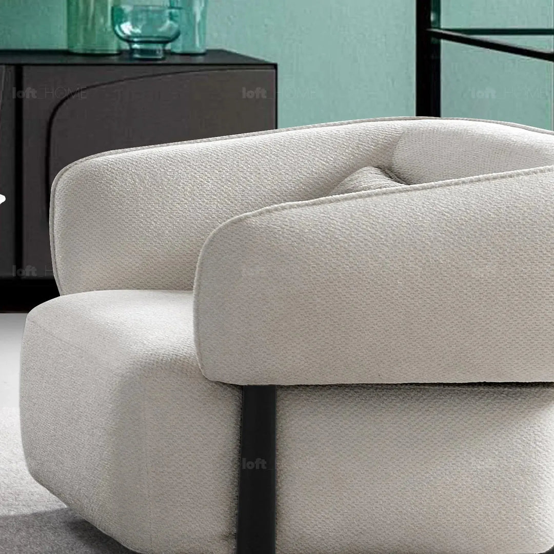 Cream mixed weave fabric 1 seater sofa callee in details.