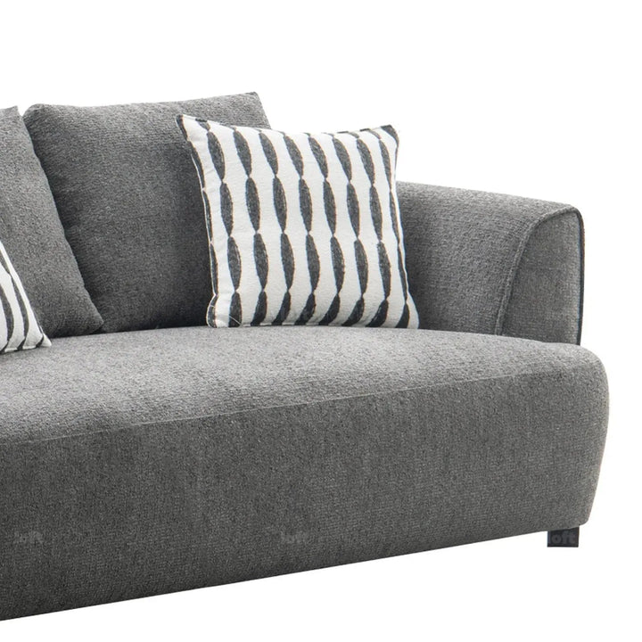 Modern mixed weave fabric 2 seater sofa oble with context.