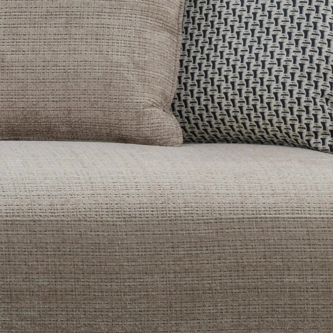Modern mixed weave fabric 4 seater sofa ense in panoramic view.