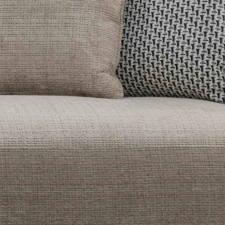 Modern mixed weave fabric 4 seater sofa ense in panoramic view.