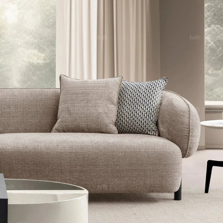 Modern mixed weave fabric 4 seater sofa ense in close up details.