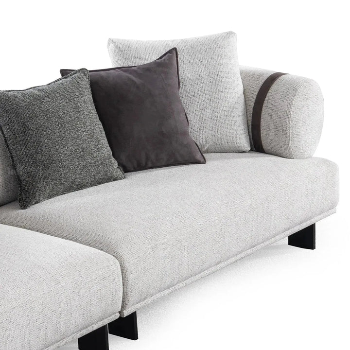 Modern mixed weave fabric 4 seater sofa divan in panoramic view.