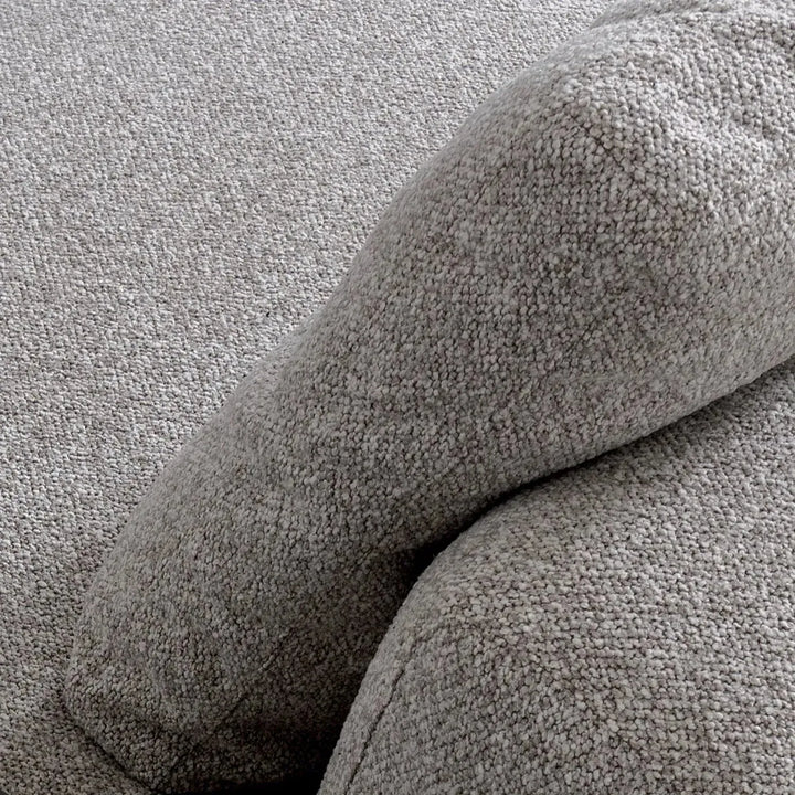 Minimalist mixed weave fabric 4 seater sofa sanctuary in panoramic view.