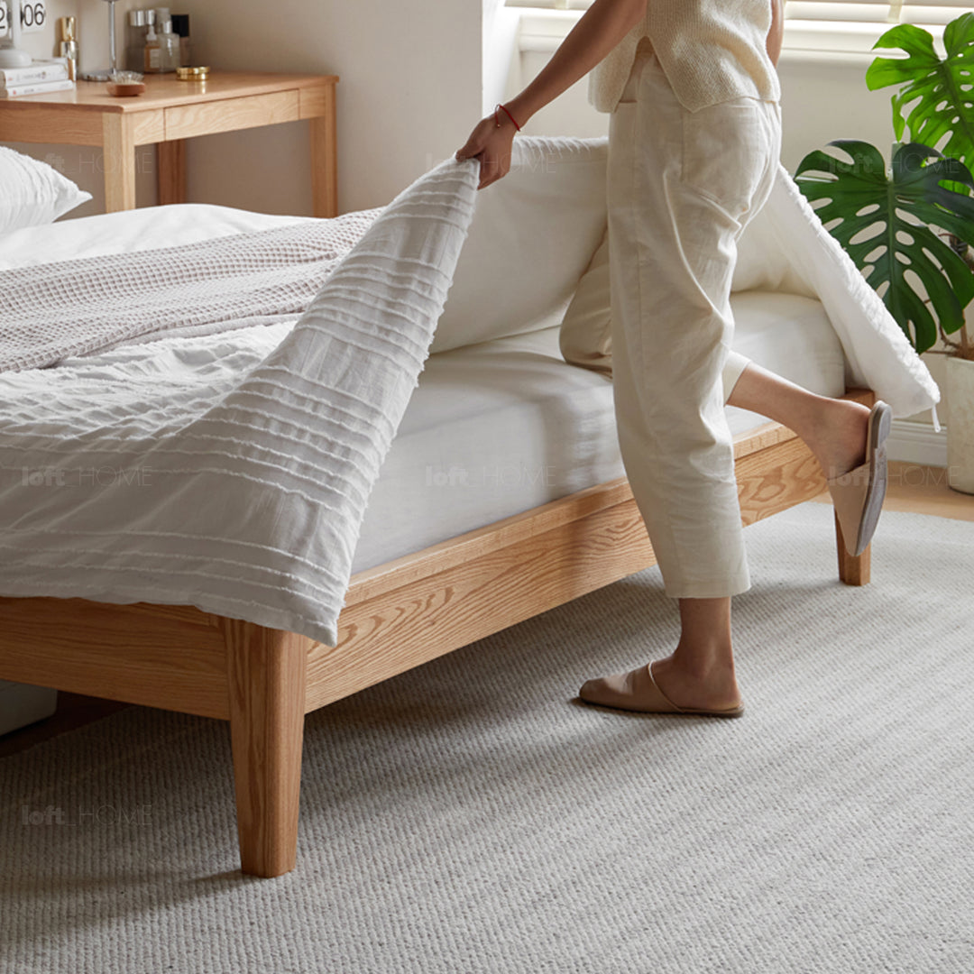 Minimalist oak wood genuine leather bed calm in close up details.