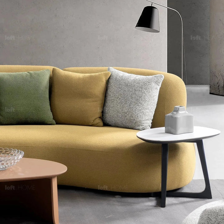 Cream sherpa fabric 5 seater sofa arch in close up details.