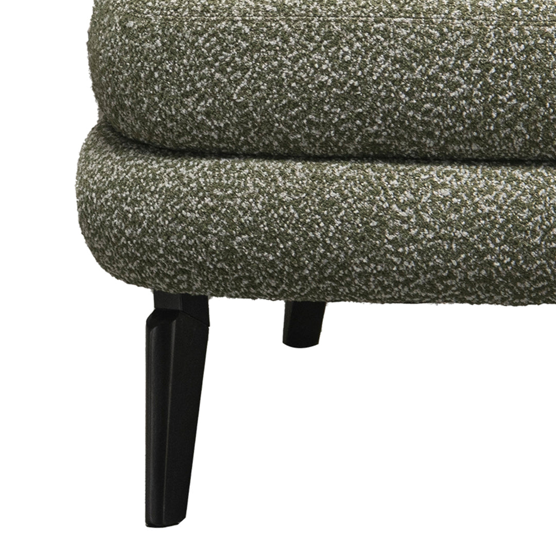 Cream boucle fabric 1 seater sofa moss with context.