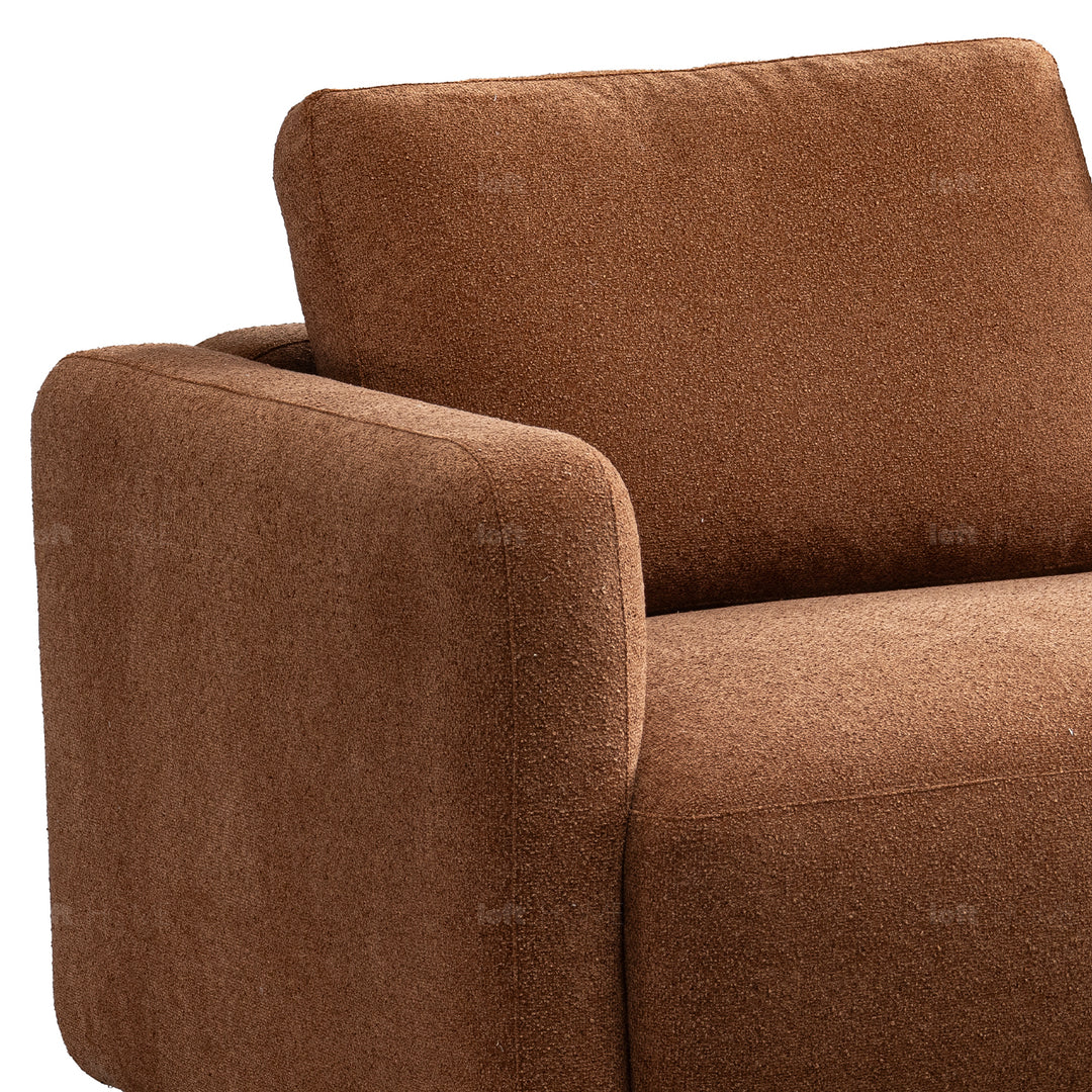 Modern boucle fabric 2 seater sofa rusty with context.