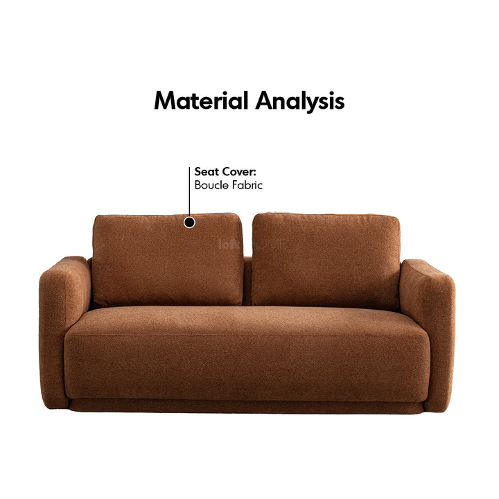 Modern boucle fabric 2 seater sofa rusty in close up details.