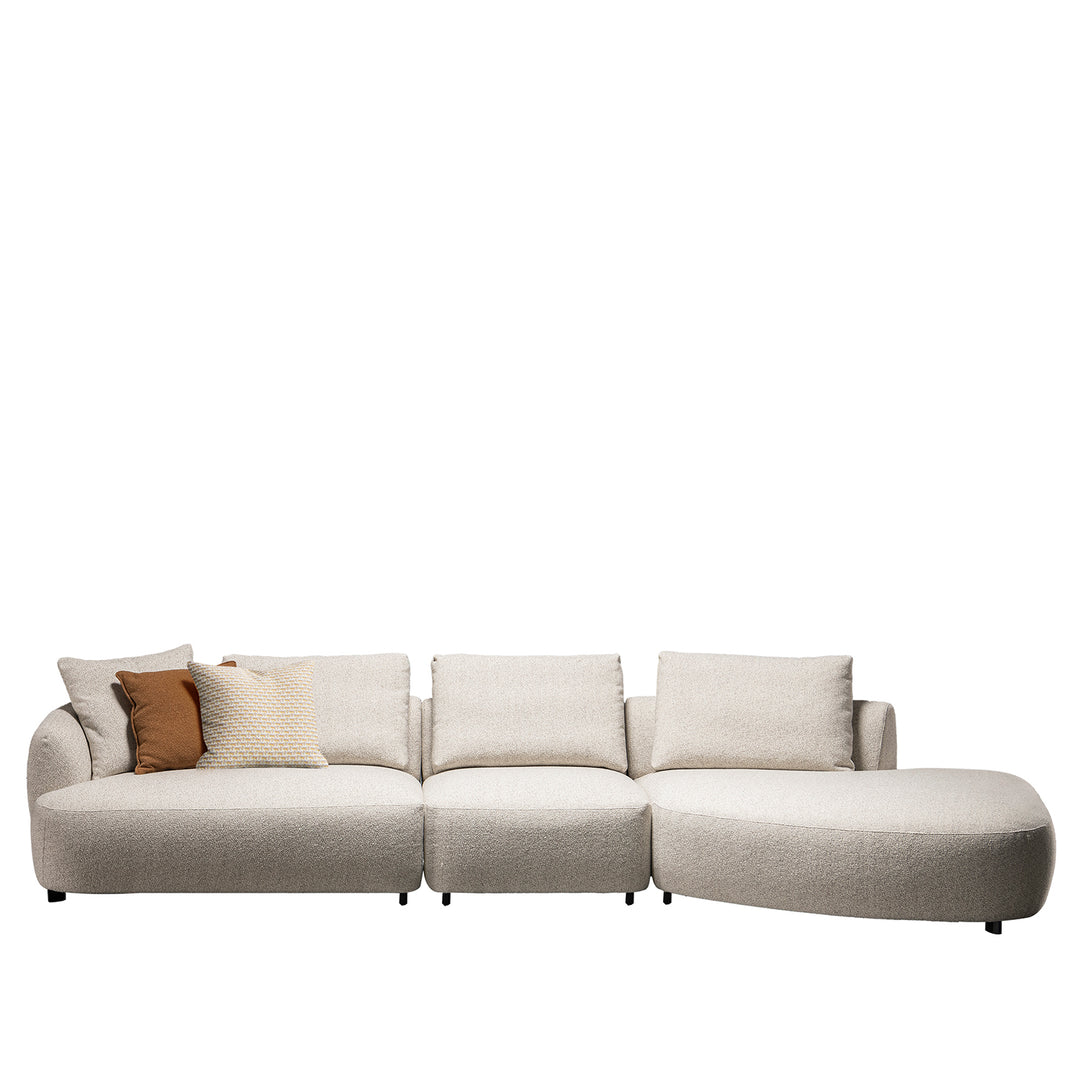 Cream boucle fabric modular armless 1 seater sofa serene in panoramic view.
