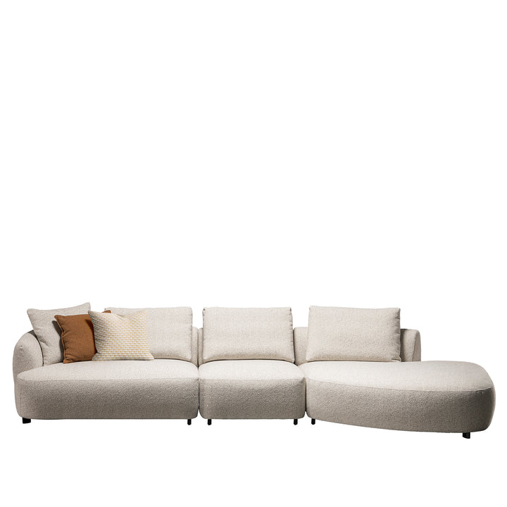 Cream boucle fabric modular armless 1 seater sofa serene in panoramic view.