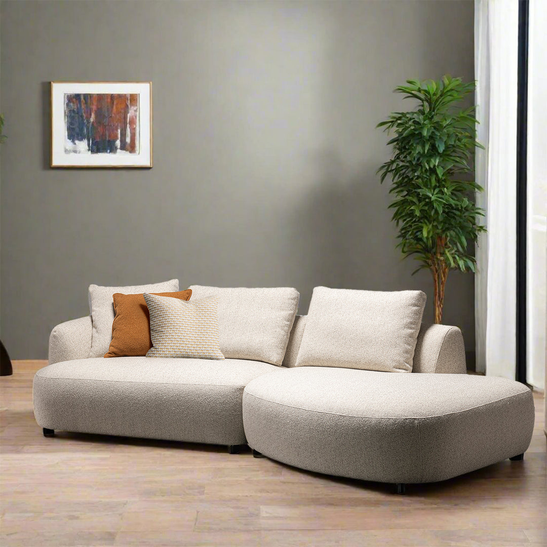 Cream boucle fabric modular corner 1 seater sofa serene in still life.