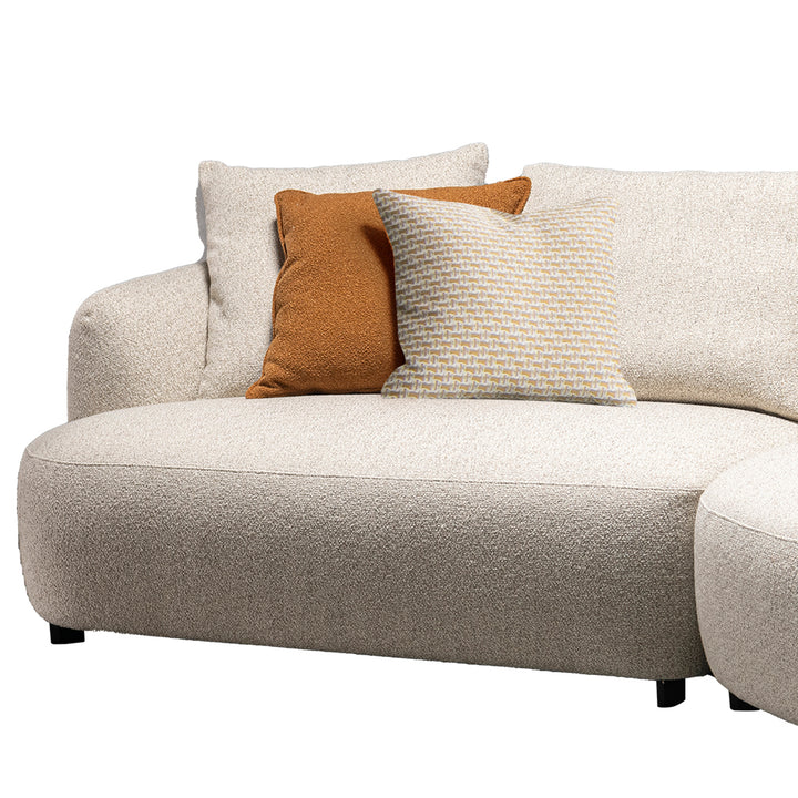 Cream boucle fabric modular corner 1 seater sofa serene in details.
