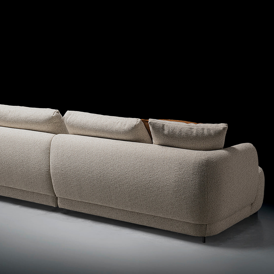 Cream boucle fabric modular corner 1 seater sofa serene in panoramic view.