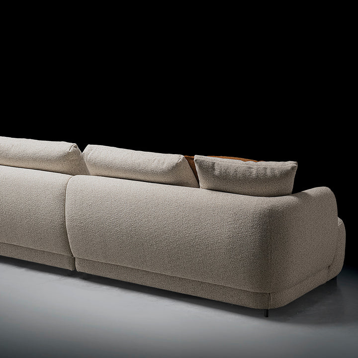 Cream boucle fabric modular corner 1 seater sofa serene in panoramic view.