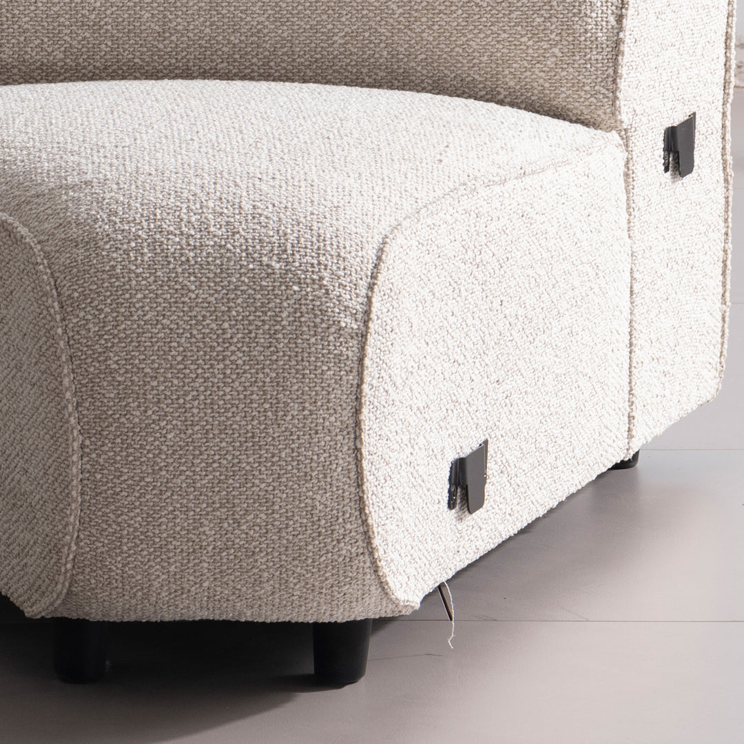 Minimalist boucle fabric modular joint connection 1 seater sofa colle in panoramic view.