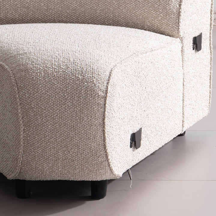 Minimalist boucle fabric modular joint connection 1 seater sofa colle in panoramic view.