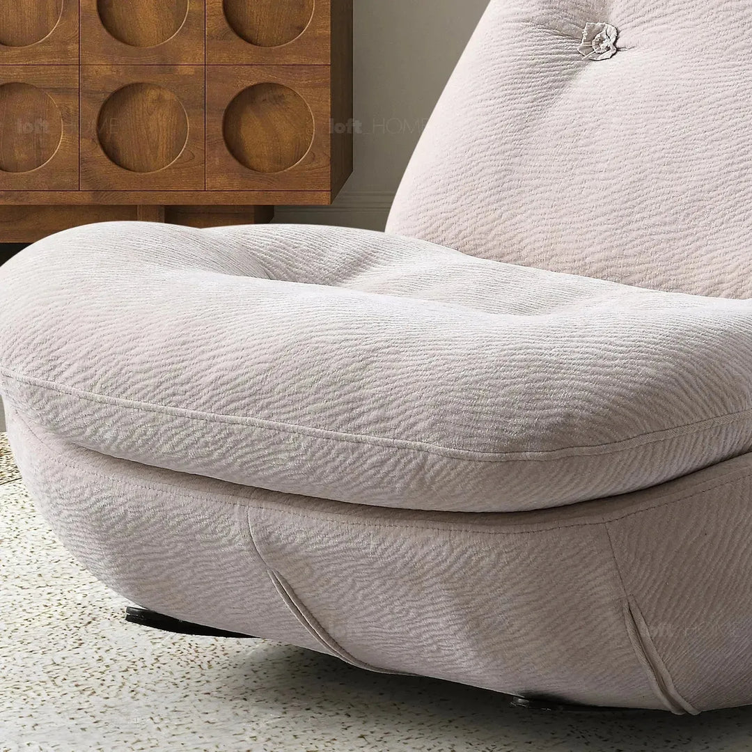 Cream chenille velvet fabric rocking 1 seater sofa nebula in still life.