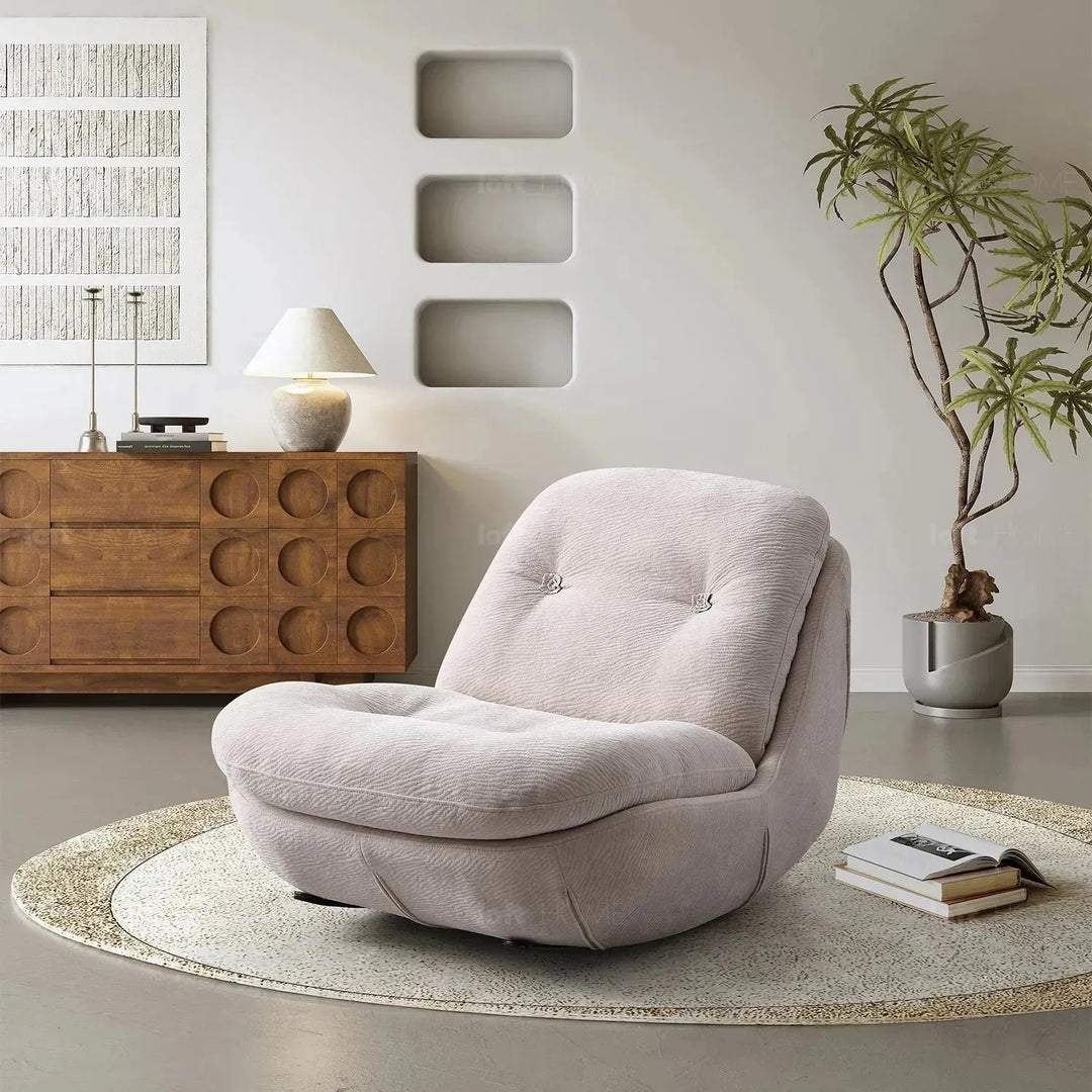 Cream chenille velvet fabric rocking 1 seater sofa nebula in close up details.