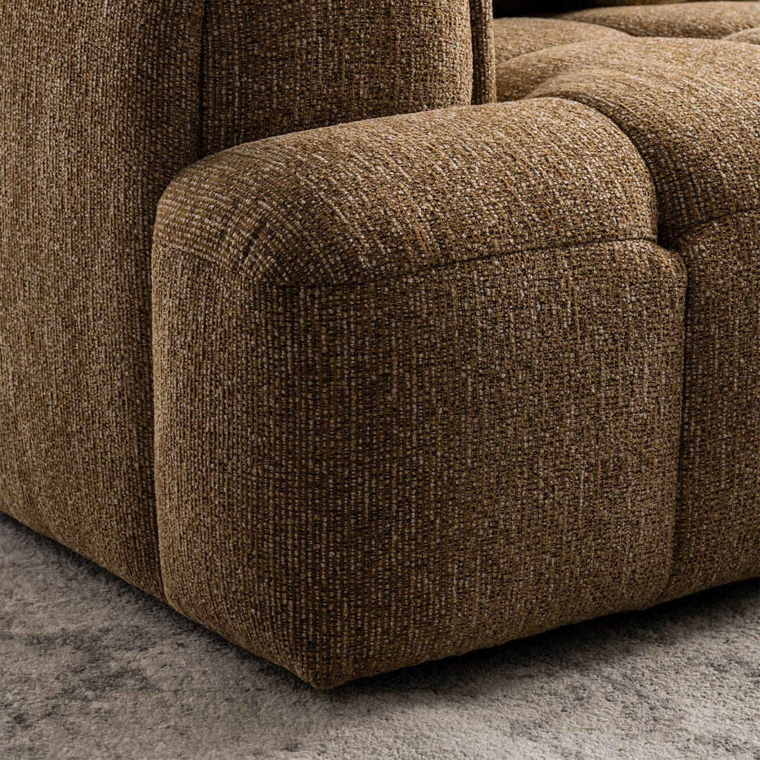 Modern mixed weave fabric 3 seater sofa puff with context.