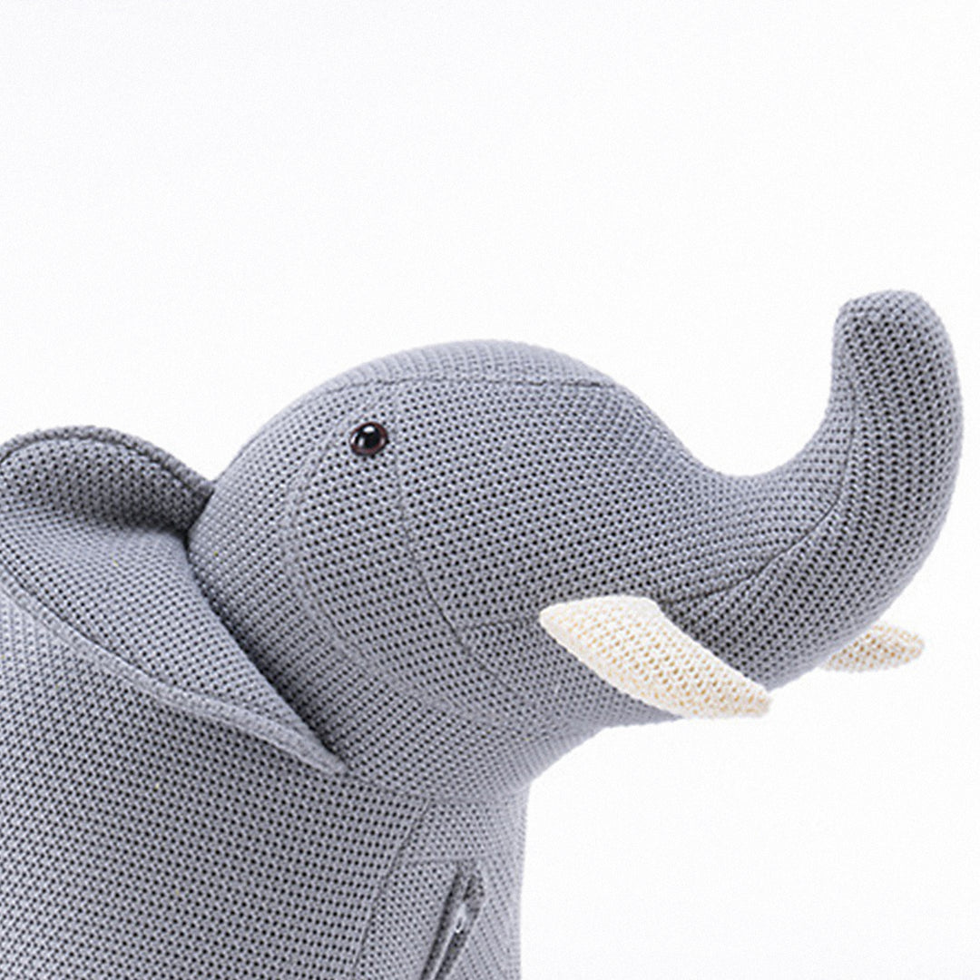 Contemporary mixed weave fabric ottoman decoration elephant in panoramic view.